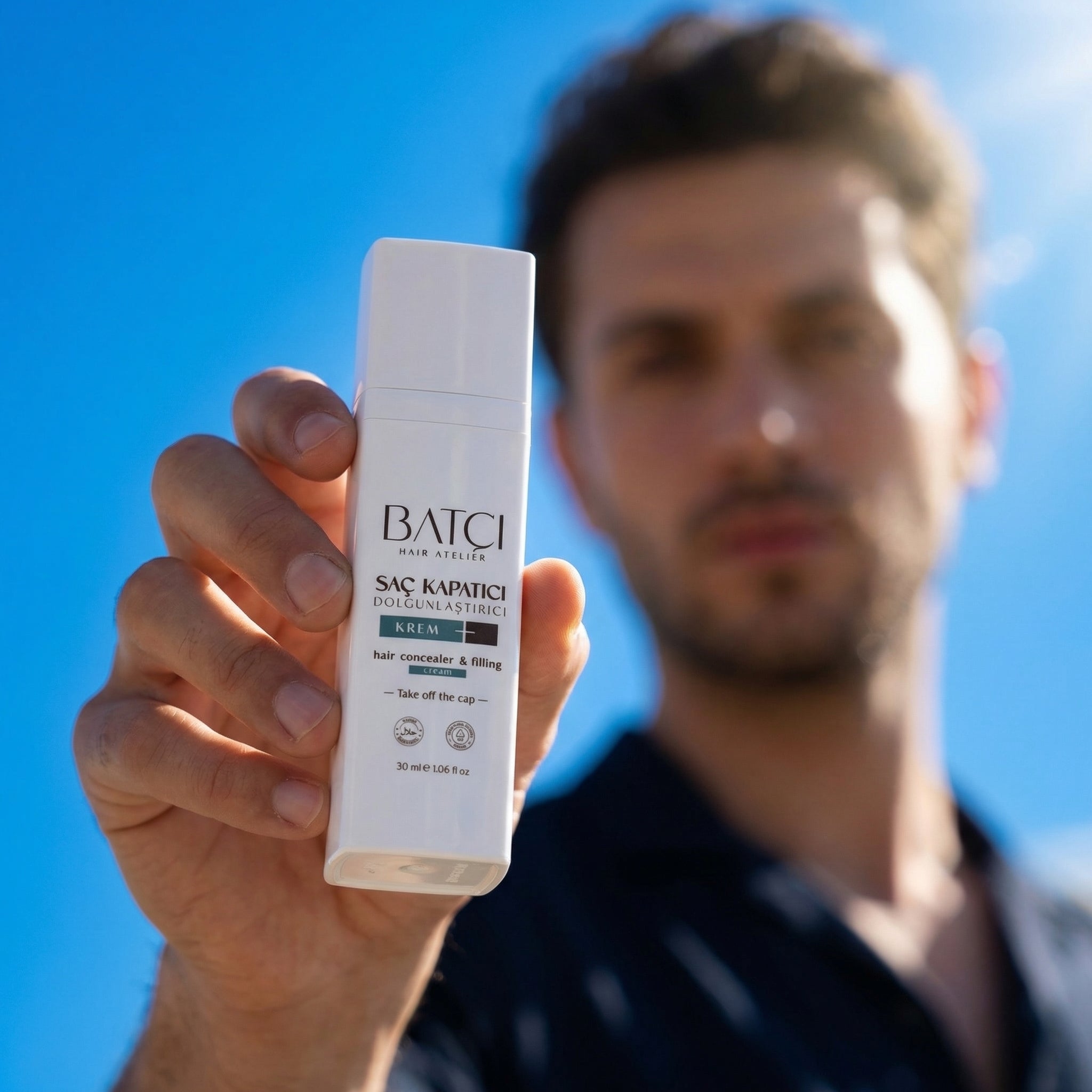 Hair Atelier Hair Concealer spray held in hand for quick hair coverage