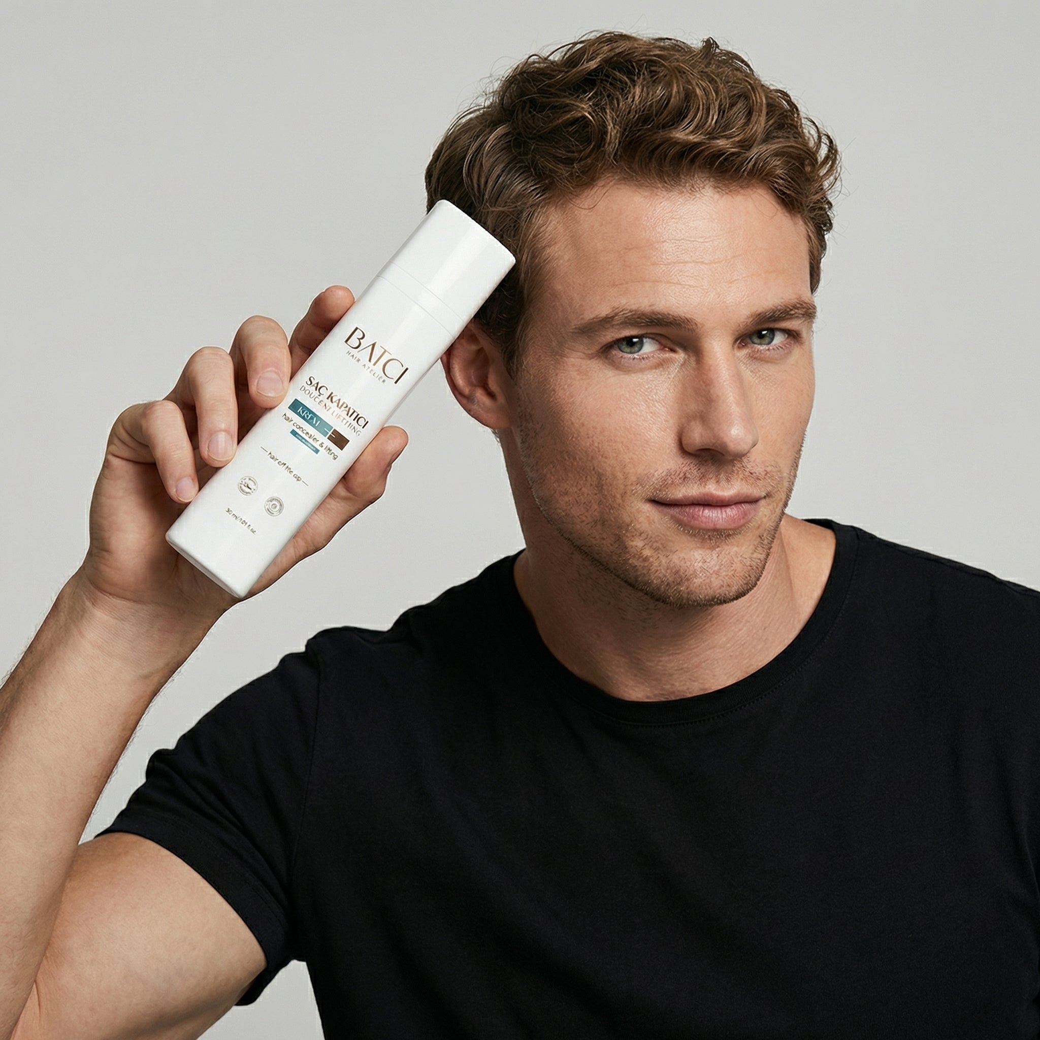 Hair Atelier Hair Concealer spray held in hand for quick hair coverage